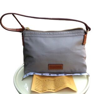 Dooney and Bourke Hand Bag. New comes with registration number.